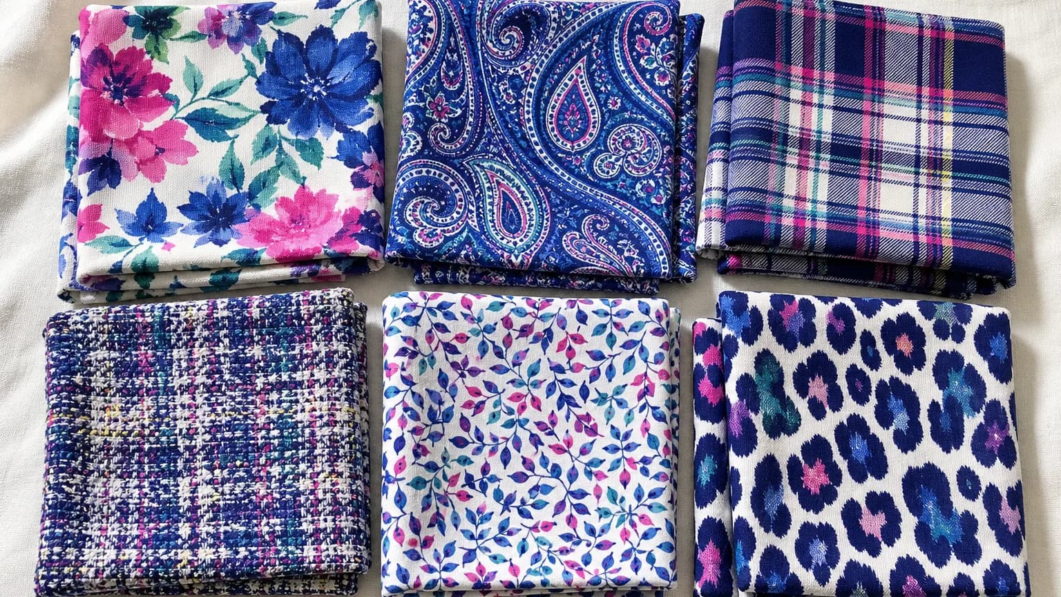 Bright Winter prints: watercolor floral, tonal paisley, plaid, tweed and leaf print in Icy White #F8F4F8, Royal Blue #3860B8, Hot Pink #D84888, Jade #3CA088