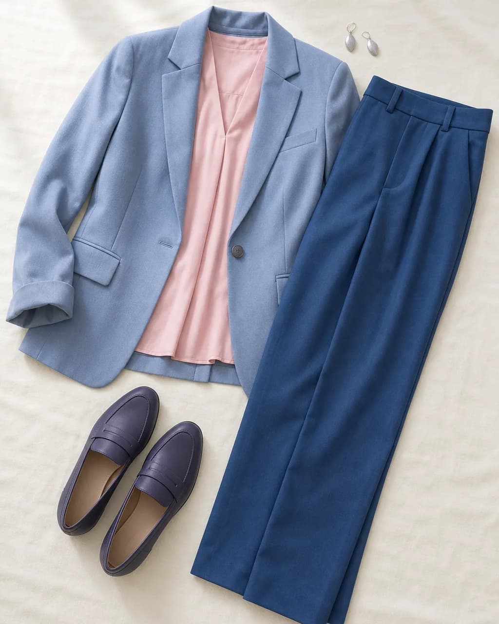 Light Summer work outfit: blazer in Cool Blue #6585B0, blouse in Soft Pink #EBAFB8, trousers in Deep Blue #2A5B87, loafers in Navy Purple #4D4470